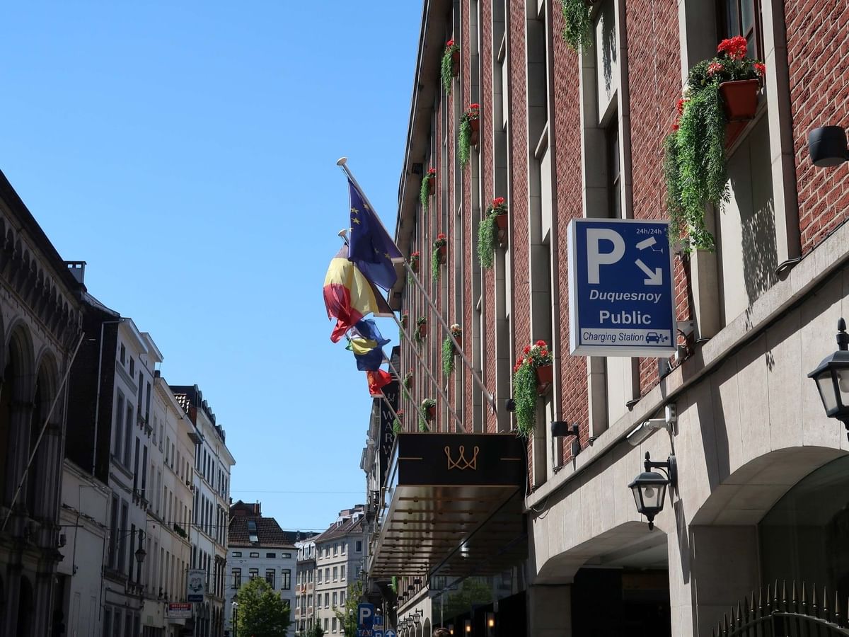 Exterior of Warwick Brussels Grand-Place with parking signage