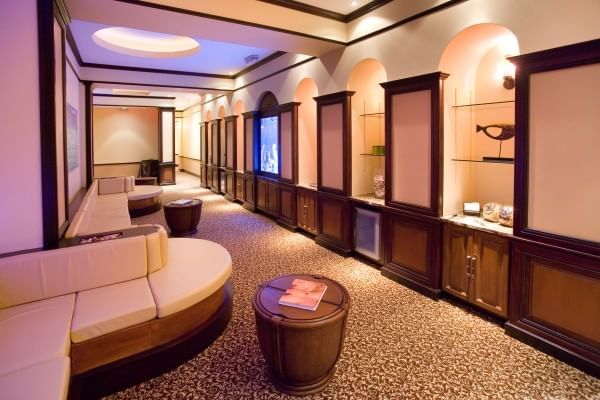 Reflections Spa & Salon interior with curved sofas at Lake Buena Vista Resort Village & Spa