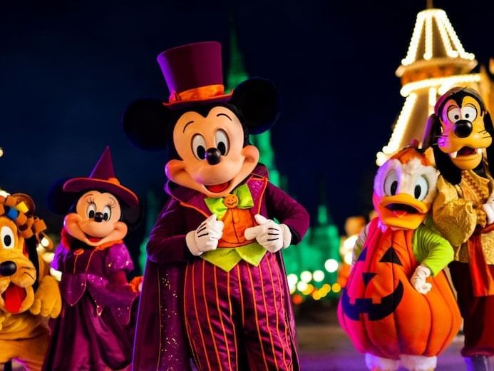 Disney characters in Halloween costumes with Mickey Mouse at Lake Buena Vista Resort Village & Spa