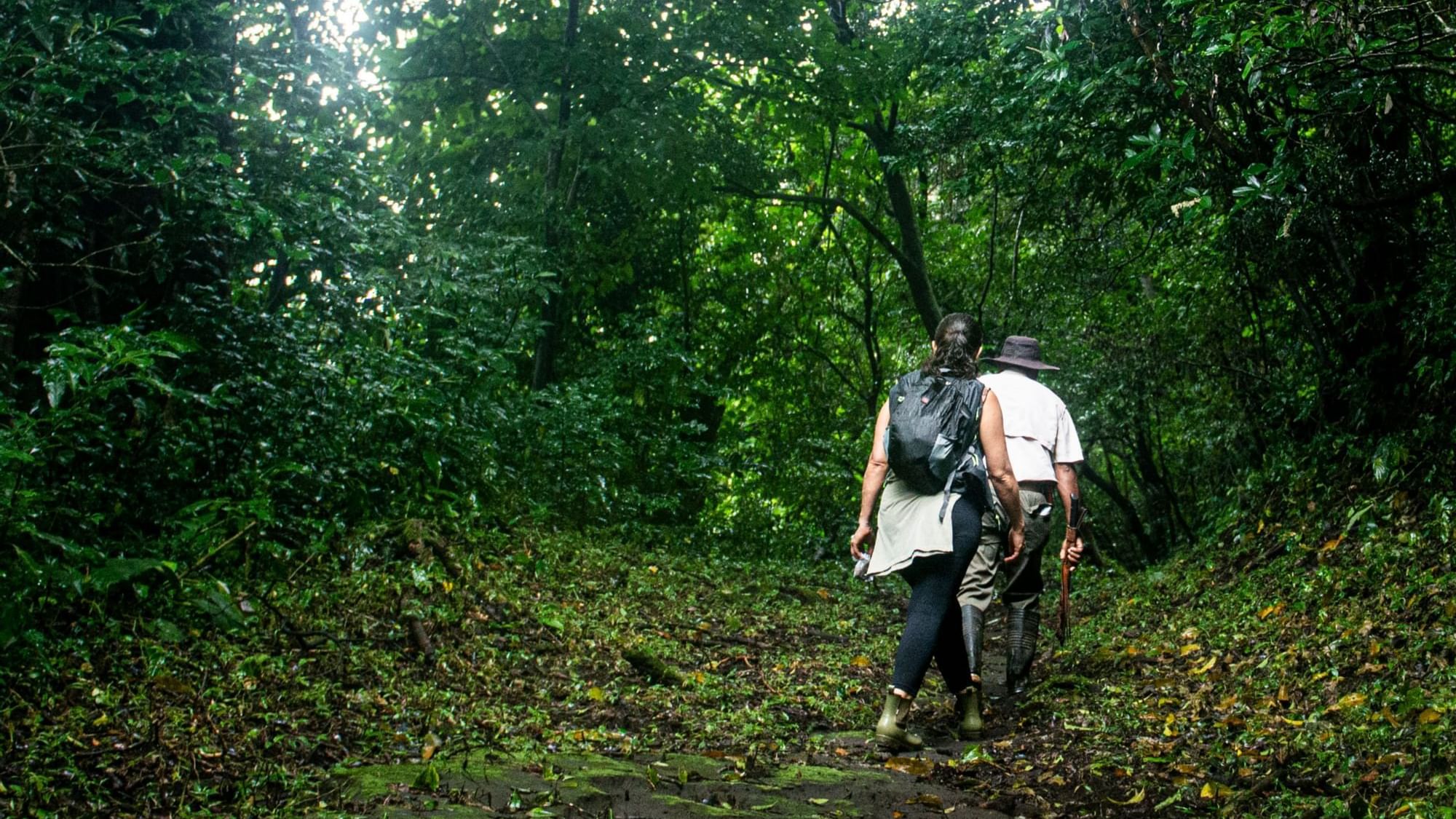 Couple hiking on a forest trail near Buena Vista Del Rincon