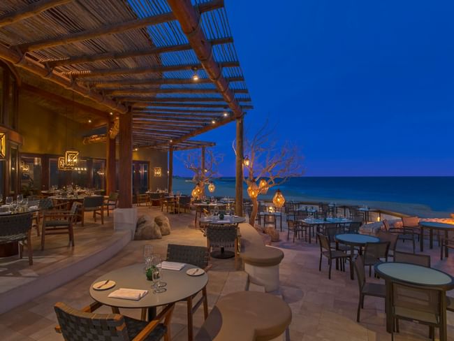 De Cortez Restaurant Exterior at night overlooking the ocean at Hacienda del Mar Los Cabos