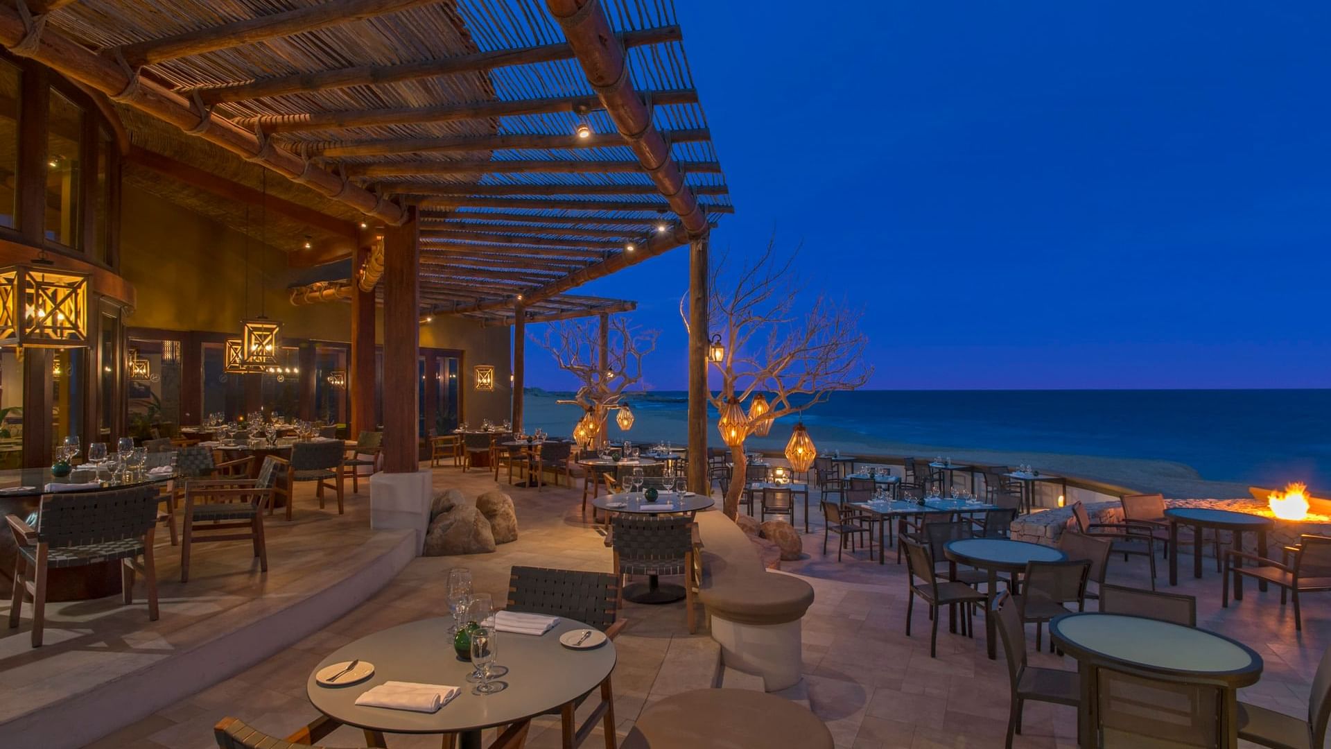 De Cortez Restaurant Exterior at night overlooking the ocean at Hacienda del Mar Los Cabos