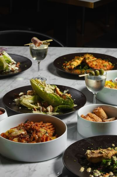 Various dishes served on a table at The Delegate Hotel