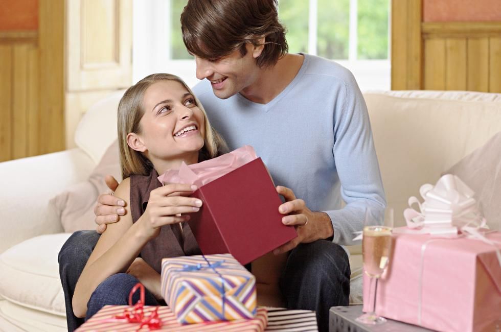 bride and groom looking at wedding gifts