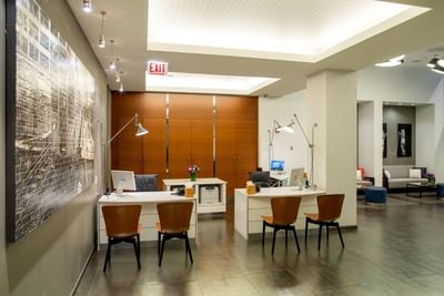 Two check-in desks in the lobby area at Kinzie Hotel