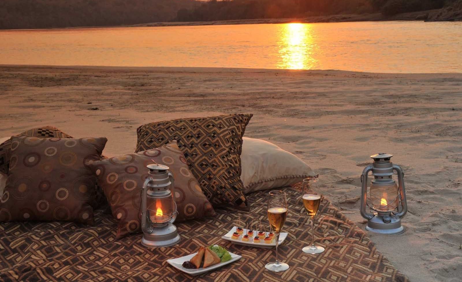 Sandbank Sundowners by the river at Serena Mivumo River Lodge