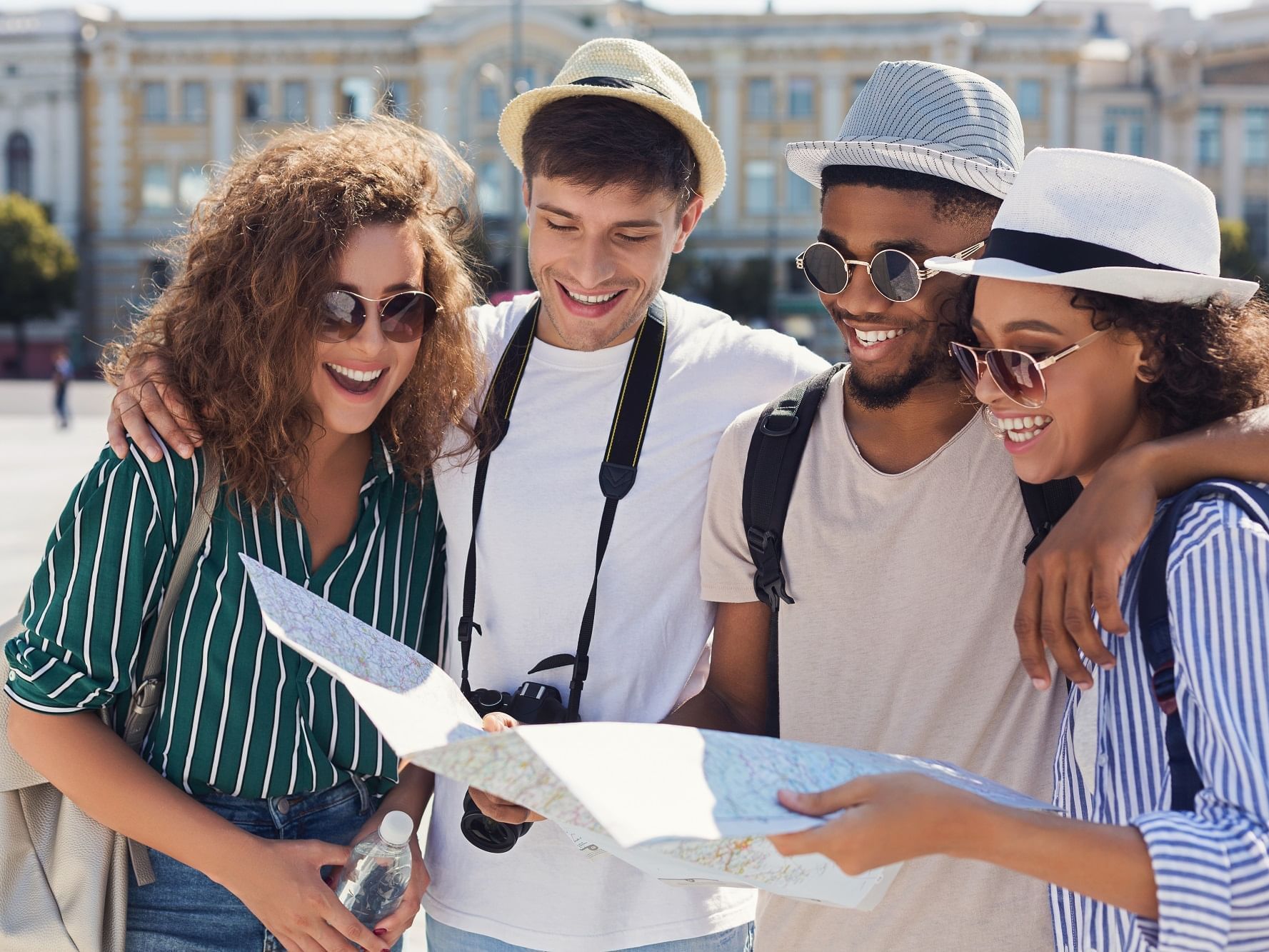 A group looking at a city map near Hôtel de l'Europe