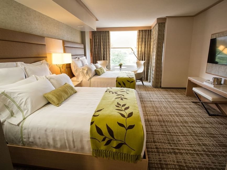 two beds facing a tv