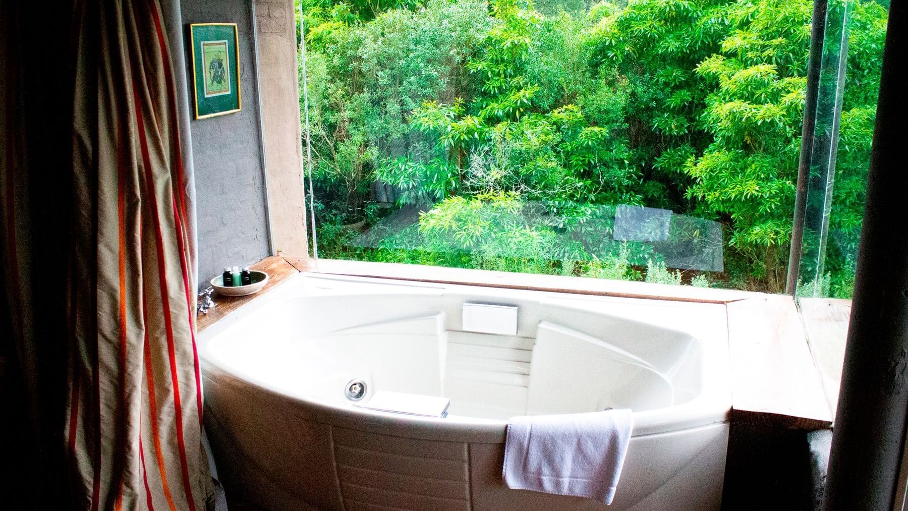 Jacuzzi with a forest view in Deluxe Suite at DOT Hotels