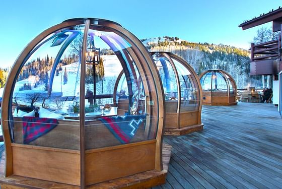 Exterior of Alpenglobes on a wooden deck in Stein Lodge