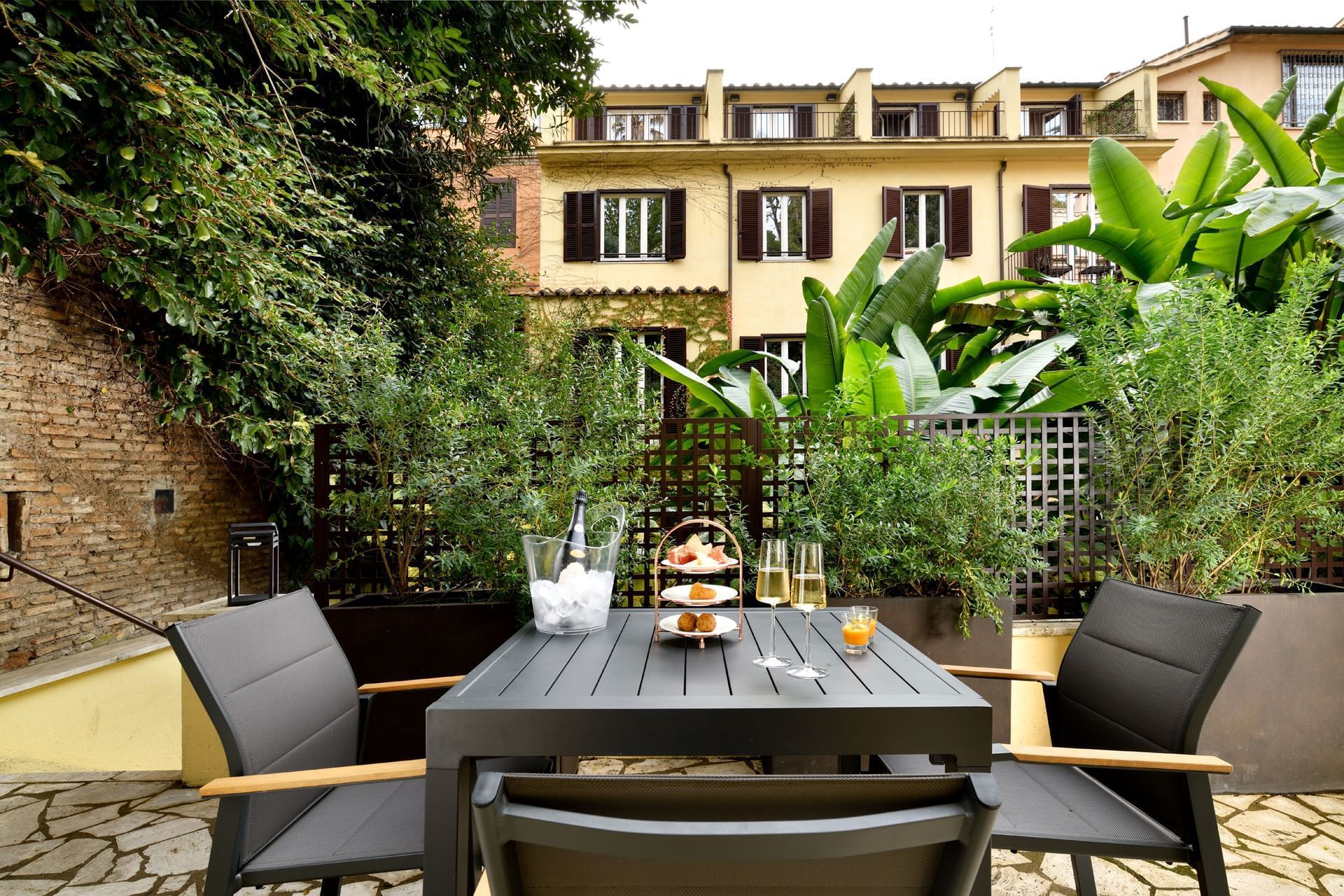 Dining table arrangement outdoors in Garden Suite at Margutta 19