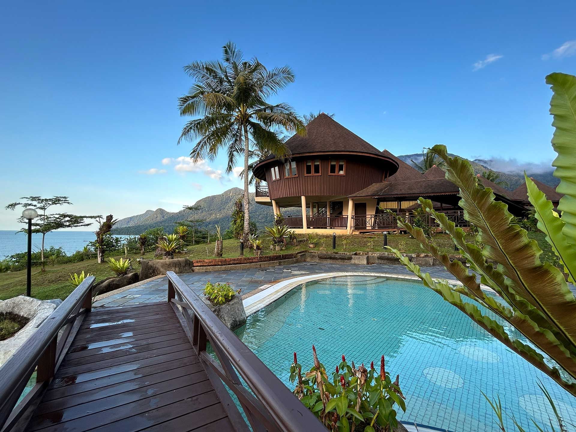 Exterior view of hotel with outdoor pool at Damai Beach Resort