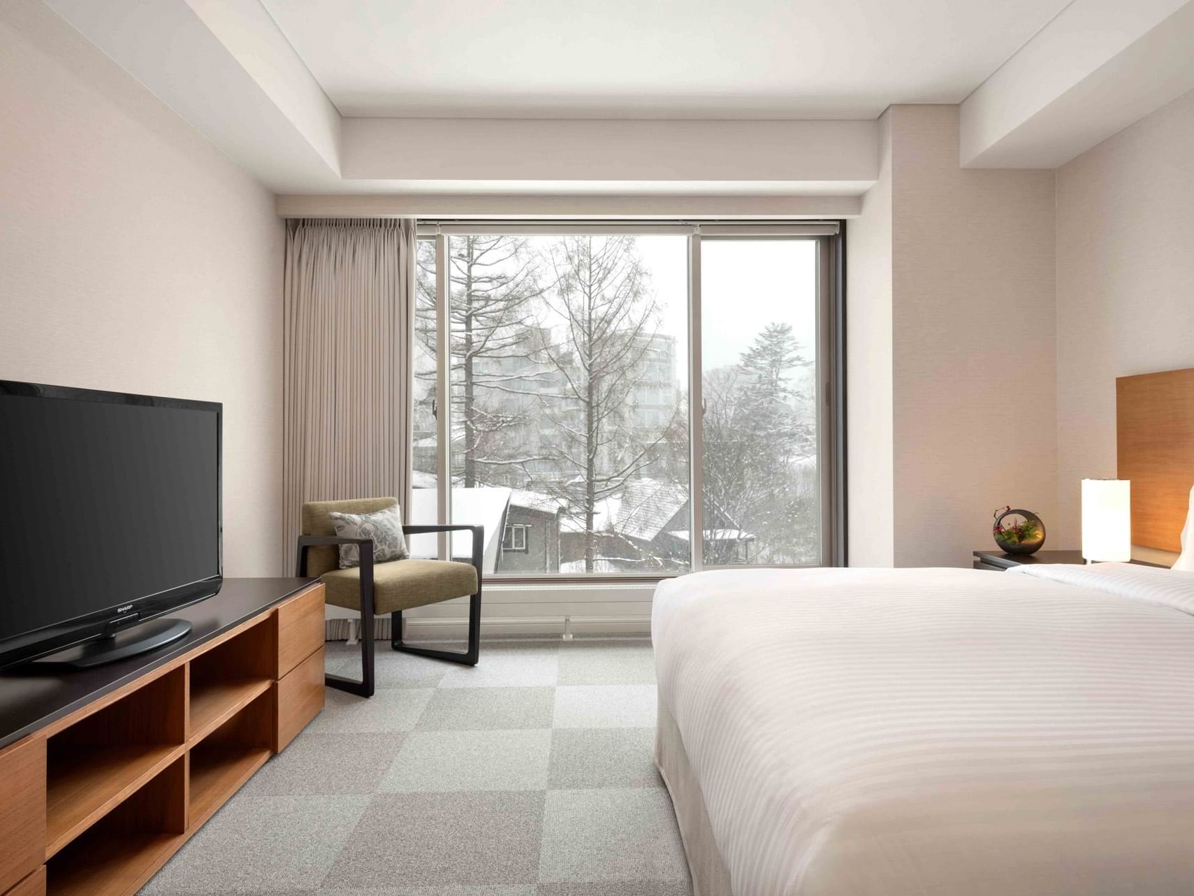 Bed & TV in 1 Bedroom Suite City View at Chatrium Niseko