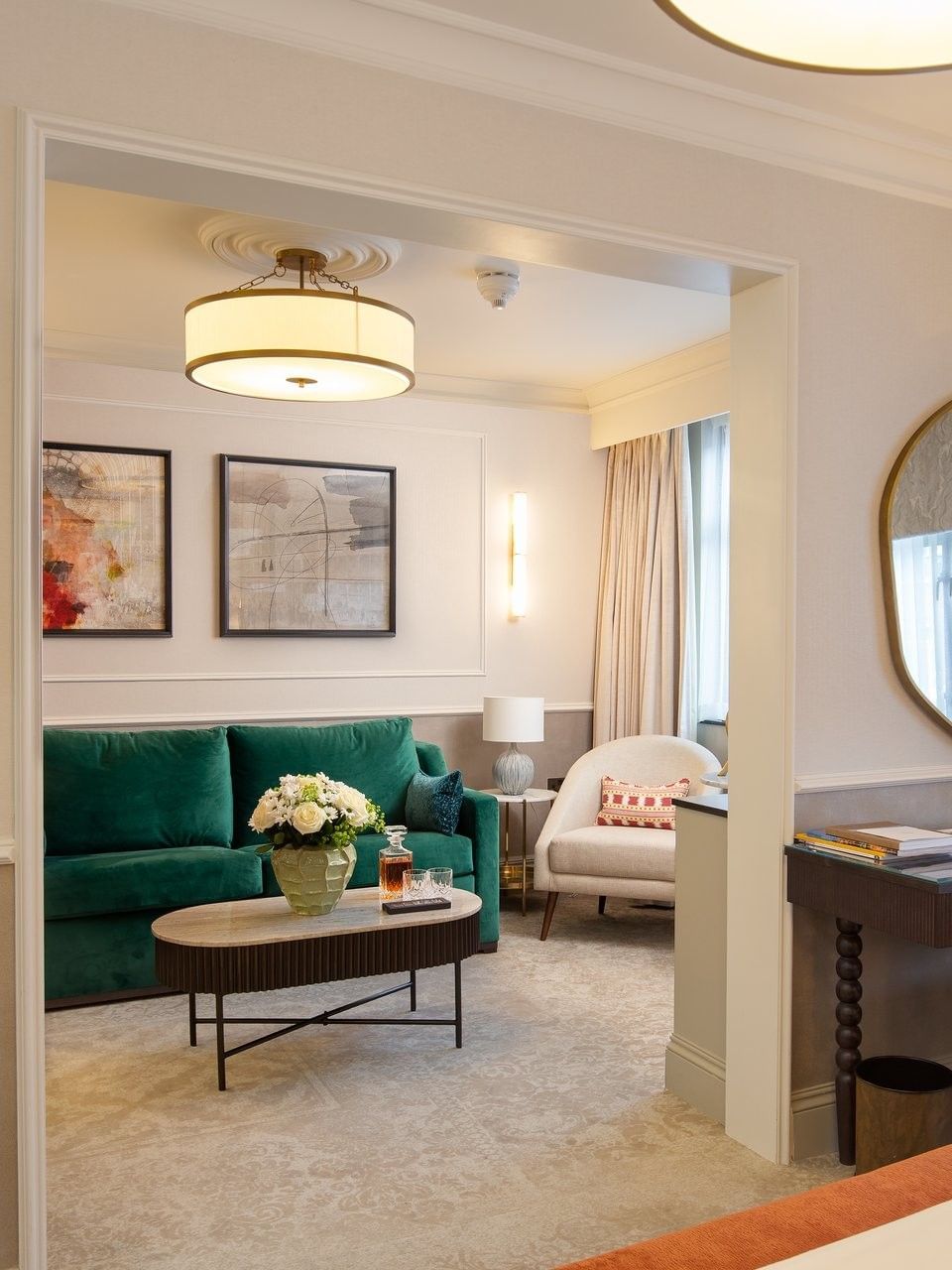 Elegant suite with living area and bedroom at The Capital Hotel, Apartments & Townhouse