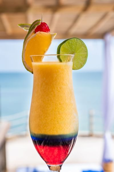 Close-up of a mocktail served with a lemon slice at Hotel Isla Del Encanto