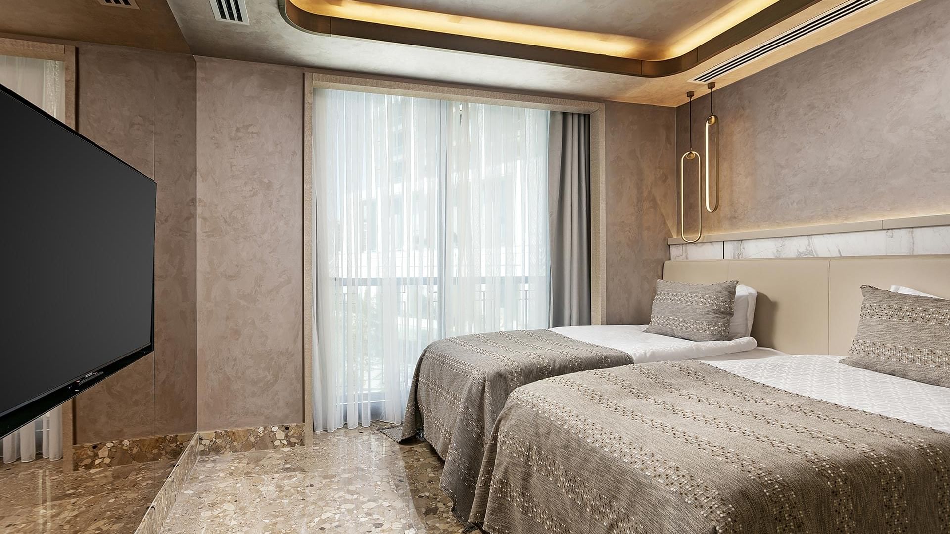 TV facing the beds in Exclusive Villa with marble-tilled floors at Cullinan Belek