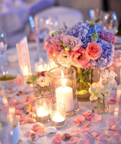 Close up of flowers & candles set up on table at Danna Langkawi