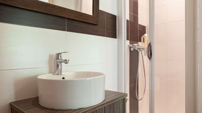 Bathroom vanity in bedrooms at Hotel Le Lodge