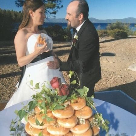 Couple with donut cake at The Somerset On Grace Bay