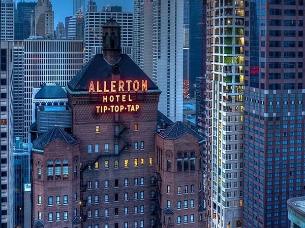 High-angle shot of Warwick Allerton Hotel's neon sign at night