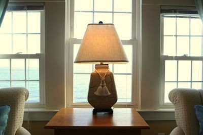 Lamp in front of windows with ocean views