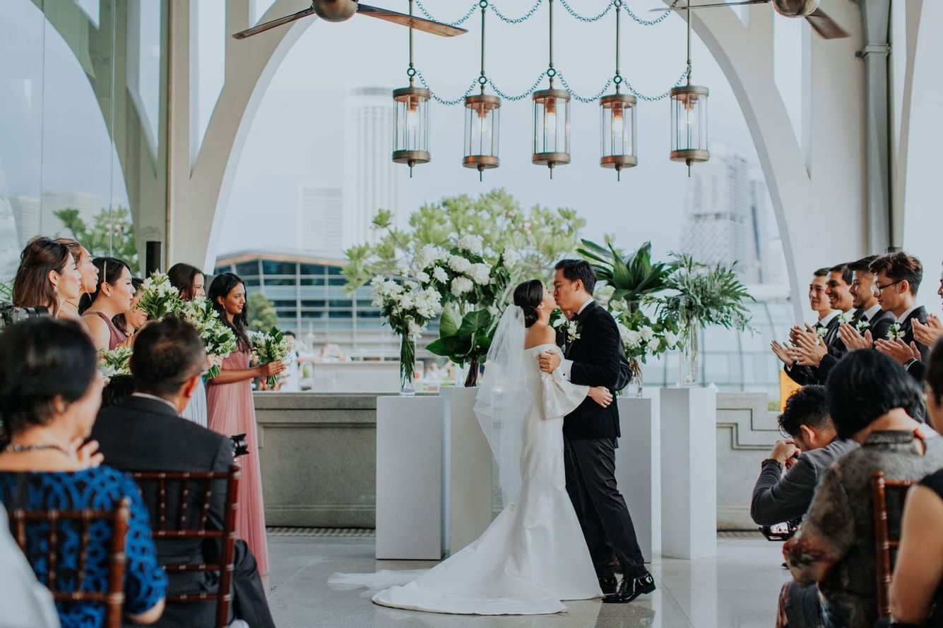 Image of a married couple in reception at Fullerton Hotels