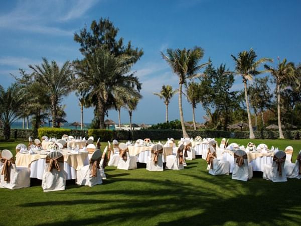 Banquet rounds set up on the Panoramic lawn at Ajman Hotel