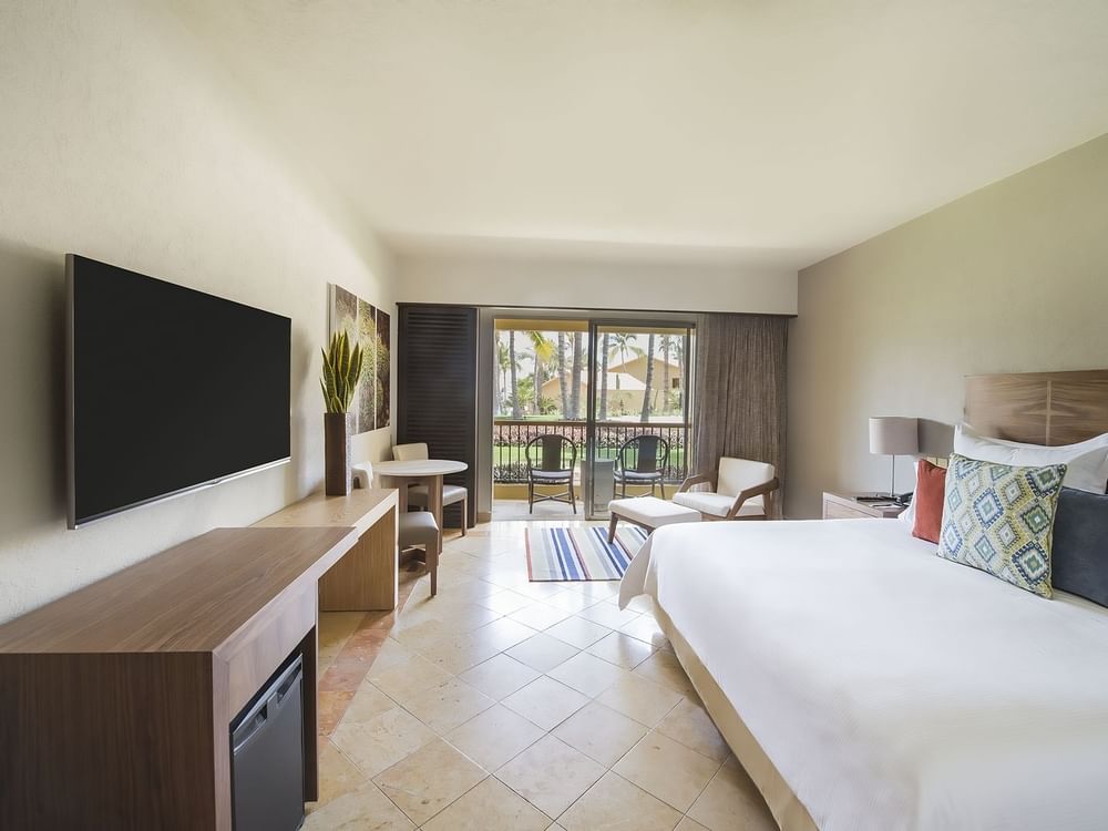 Deluxe Room with comfy king bed and TV at GFA Los Cabos