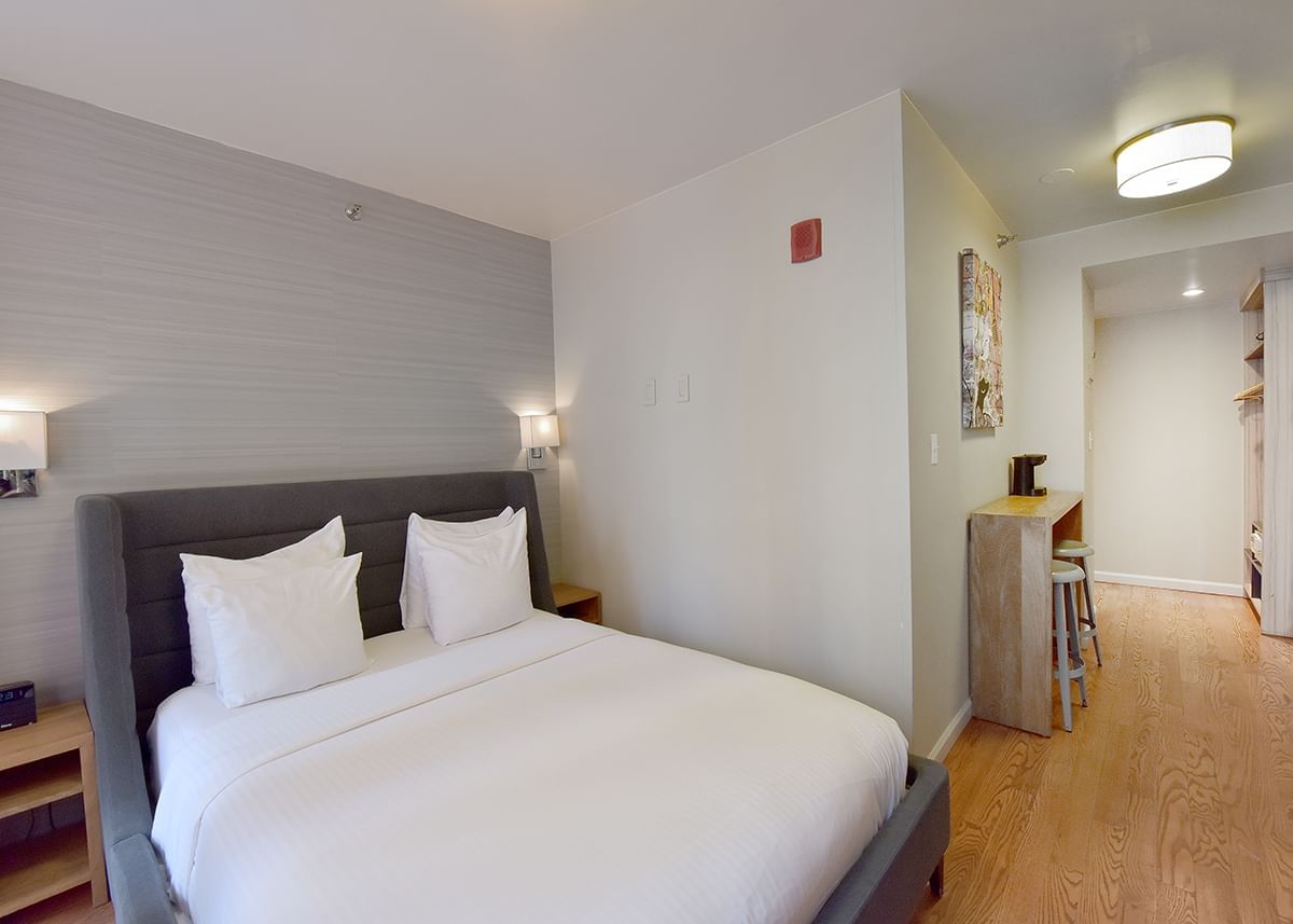 Image 30: Cozy bed & coffee table area in Full Studio with Balcony at Hotel 32|32