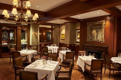 Tables and chairs in the restaurant at The Townsend Hotel