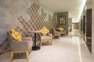 Elegant lobby lounge area with comfy chairs at Eastin Grand Hotel Saigon