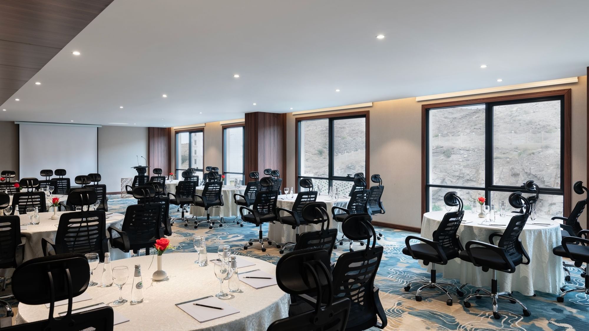 Cabaret set-up with carpted flooring in Amarige Hall at Warwick Hotels and Resorts