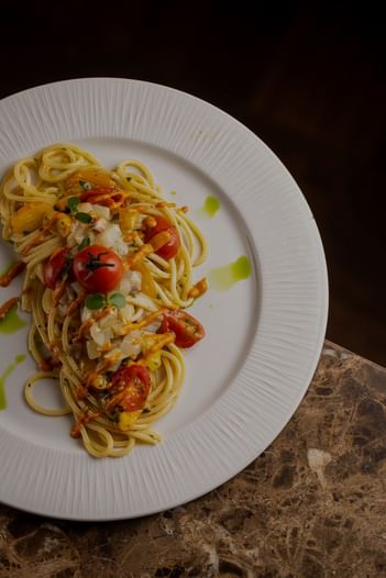 Close-up of a served seafood spaghetti plate at EMME Restaurant