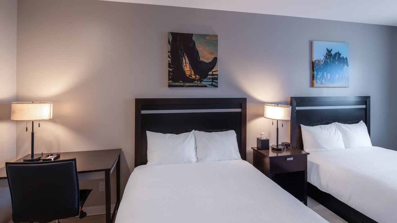 Guest room at Coast Innisfail Hotel with two queen beds