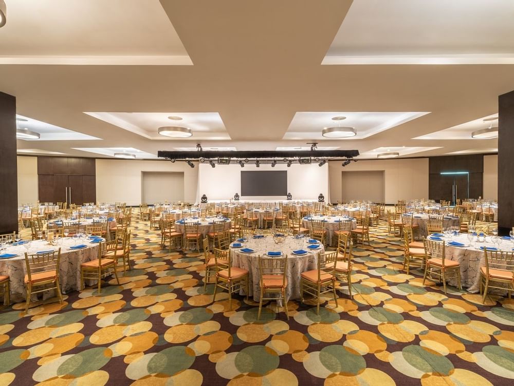 Banquet rounds arranged in The Gran Aqua Room at Live Aqua Beach Resort Cancun