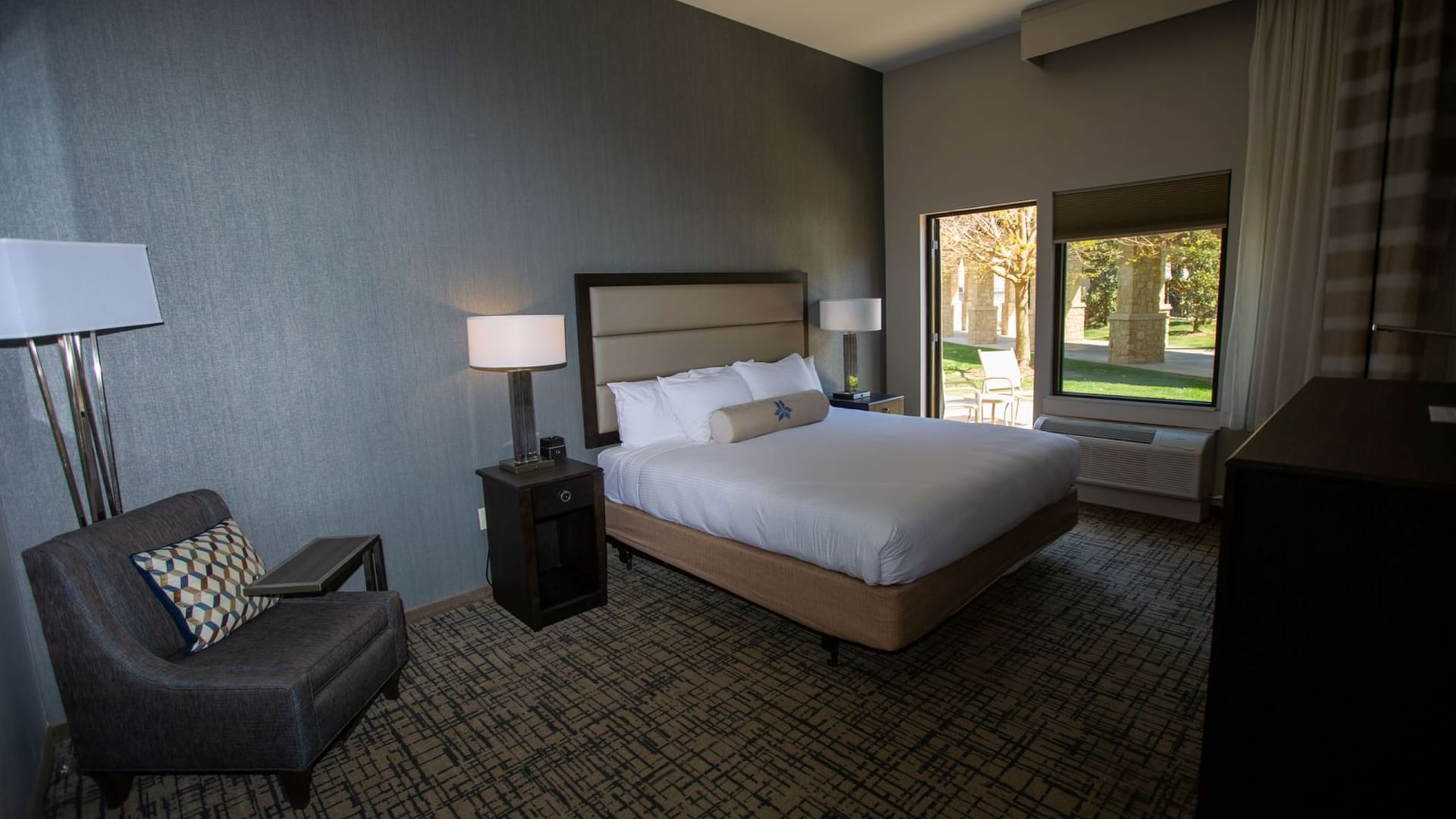 King patio room featuring a king-sized bed and a courtyard patio at Shangri-La Monkey Island