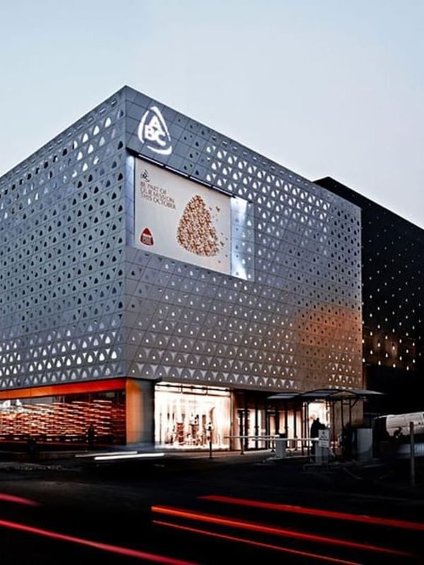 ABC Dbayeh Mall with a digital screen by a street at dusk near Warwick Stone 55 - Beirut