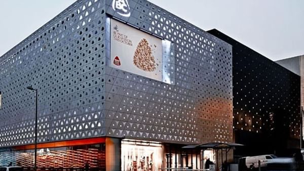 ABC Dbayeh Mall with a digital screen by a street at dusk near Warwick Stone 55 - Beirut