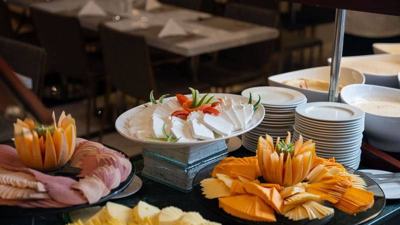 Assorted breakfast items including cheese and meats at Saja by Warwick Madinah.