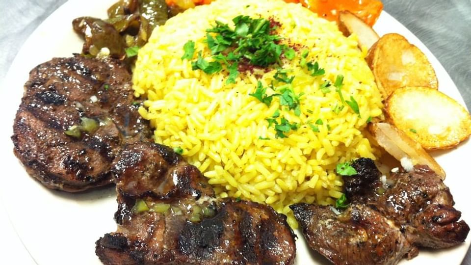 Meat & rice dish of King o Falafel near Legacy Vacation Resorts
