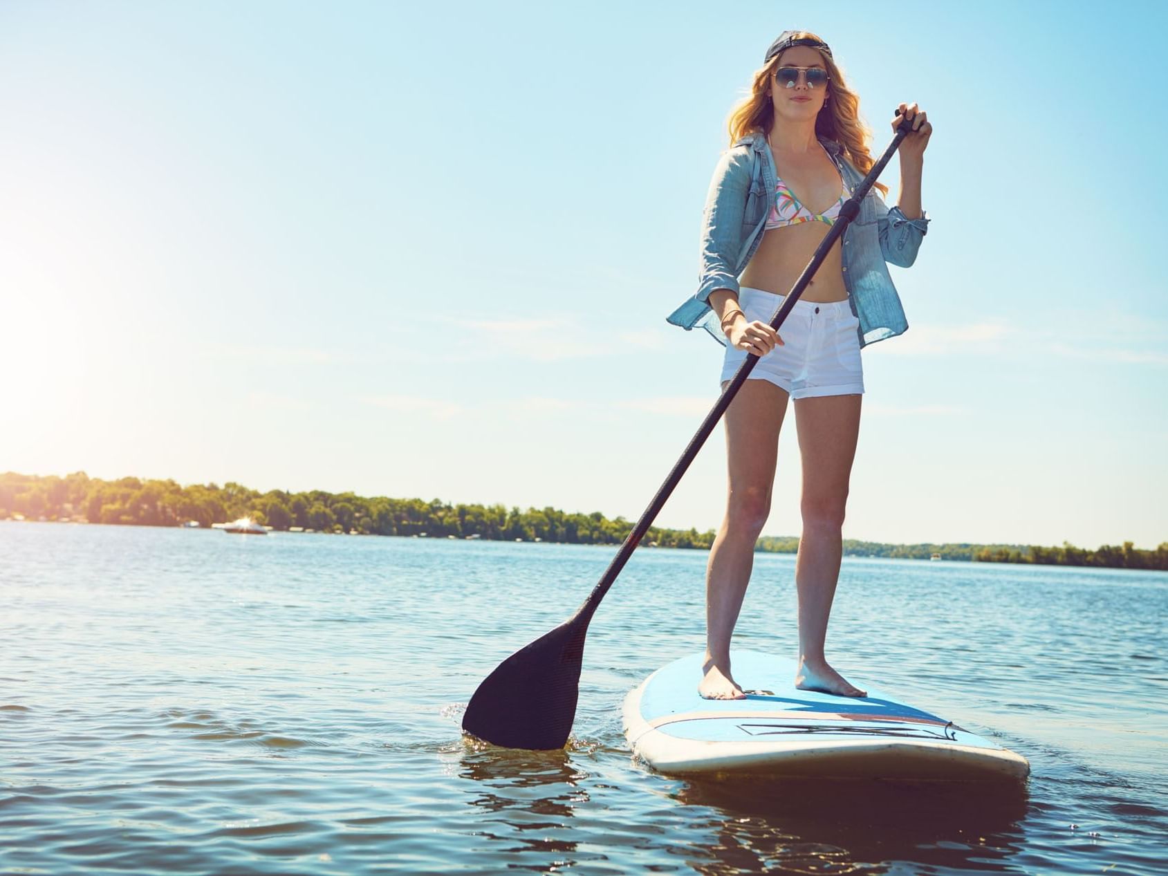 Woman paddleboarding on a river near Central Hotel Bocas Del Toro