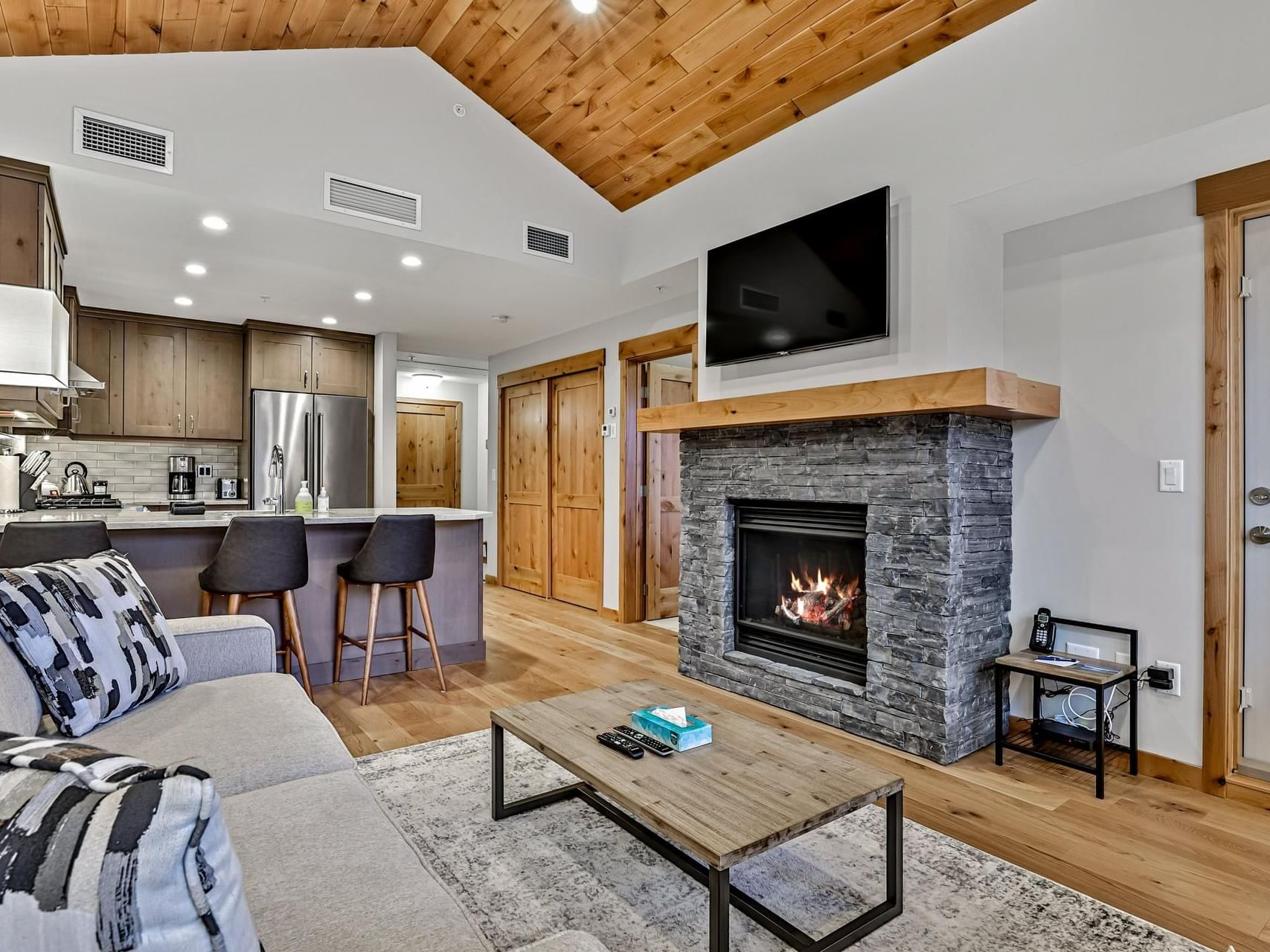 Livingroom & kitchen with an island in 409 White Spruce Lodge One Bedroom Elevated Condo at Spring Creek Vacations