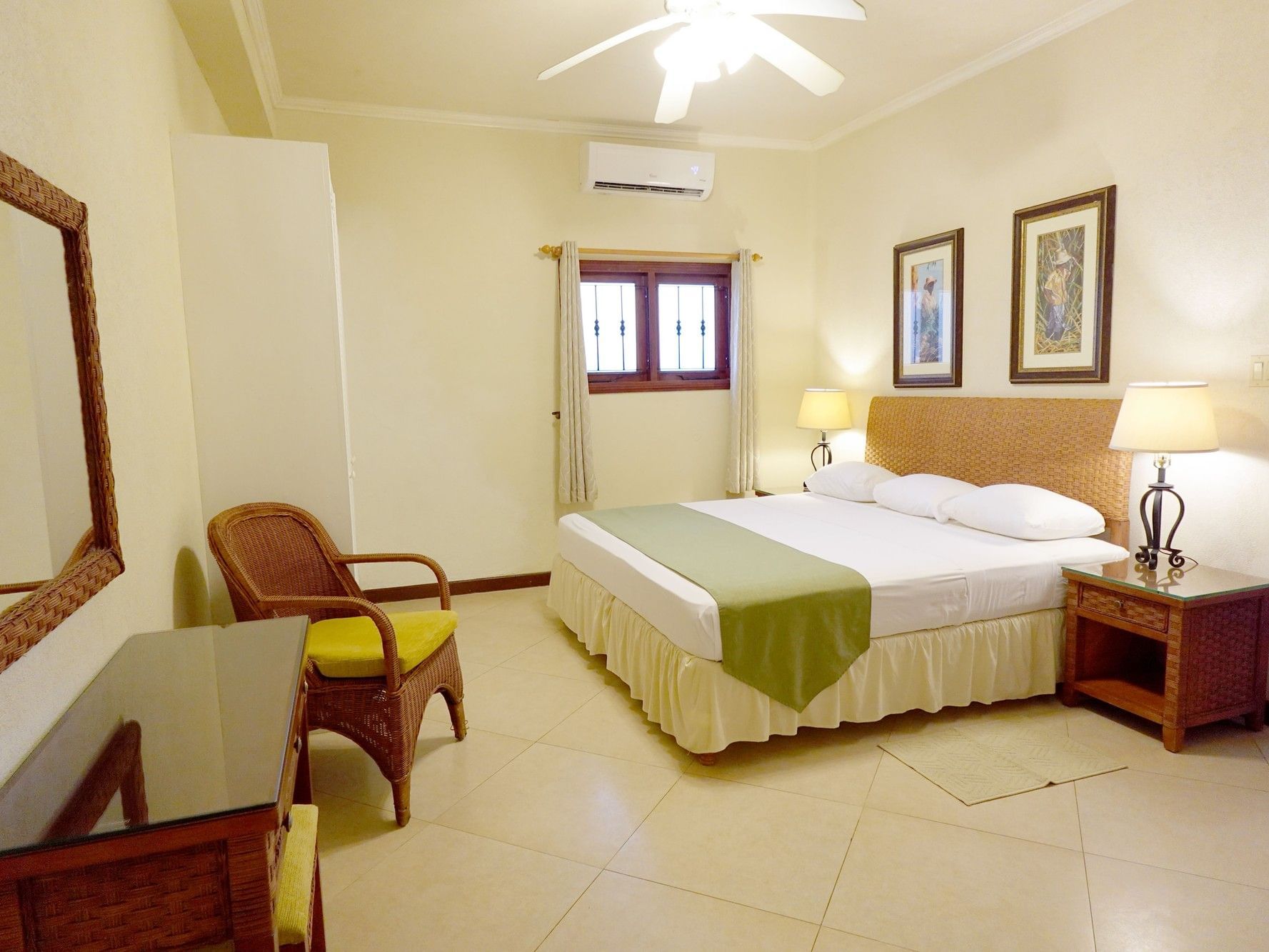 Bright Ginger Lily Suite with king bed, wicker furnishings, and tropical accents at Sugar Cane Hotel in Retreat