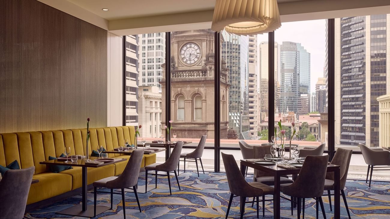 Dining area with carpeted floors in Bistro Suzette at Sofitel Brisbane Central