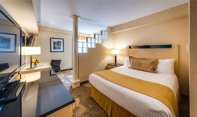 Hotel room with television in monte carlo inns markham