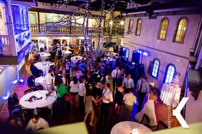 Mass of happy guests at an outdoor wedding reception