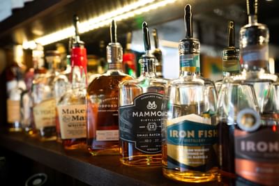 Wall of liquor choses at The Earl Lounge