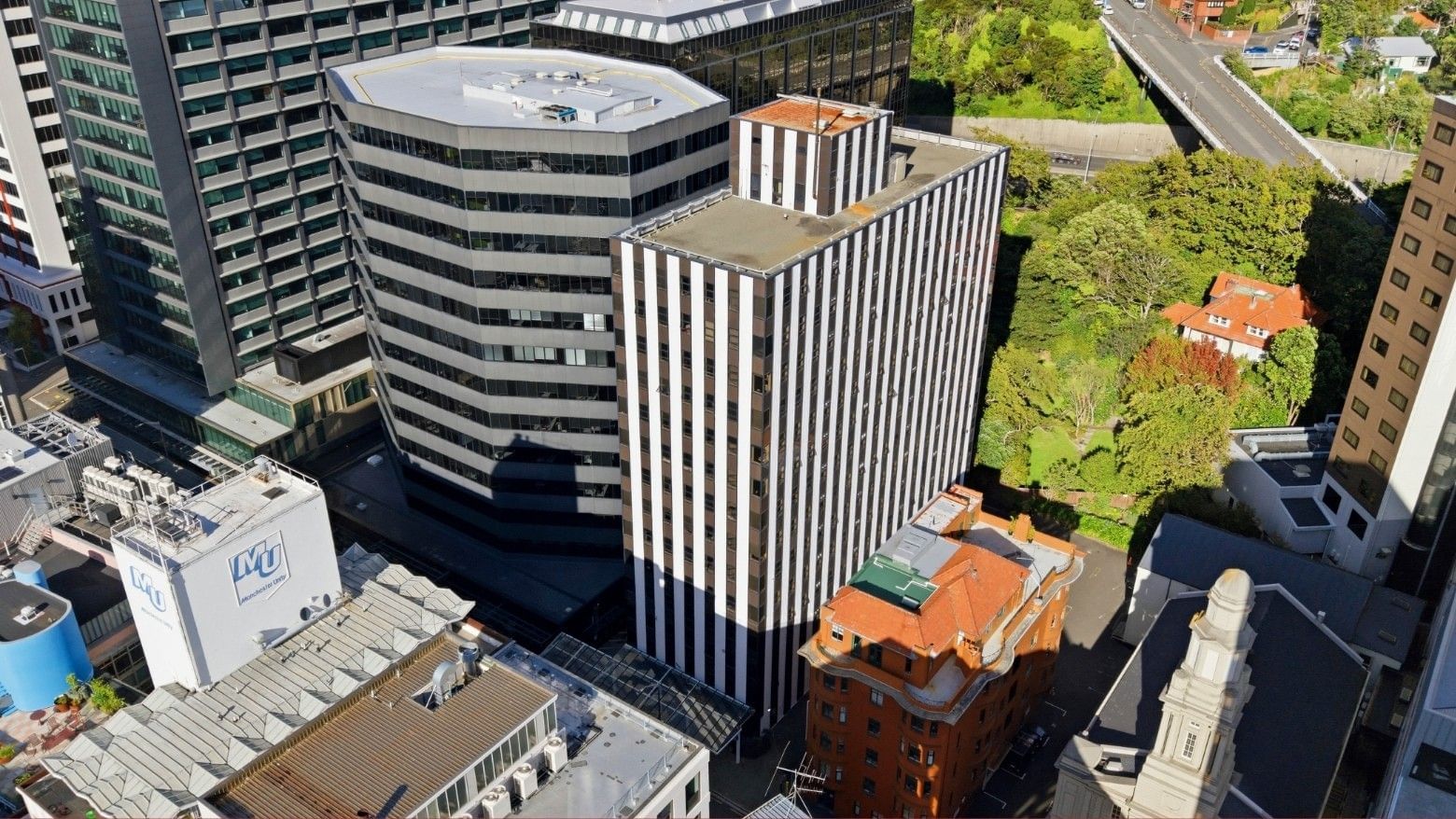 Tall buildings and greenery in an urban area with UniLodge Stafford House.