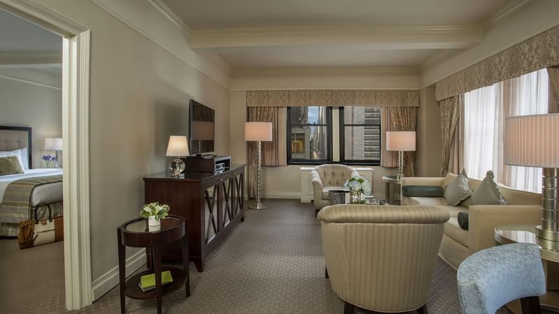 Dining area and lounge area in The Avenue One Bedroom Suite at Warwick New York