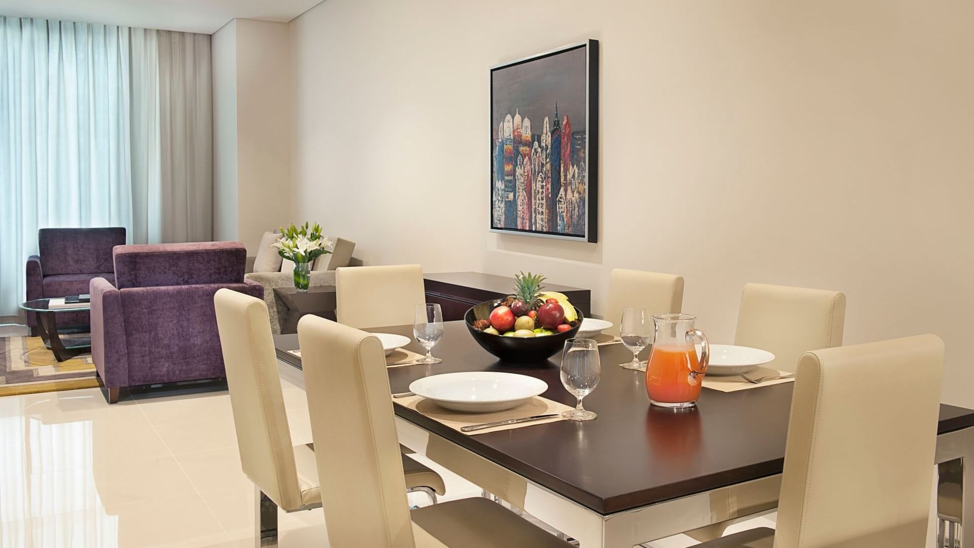 Modern dining table set-up arranged in Three Bedroom Suite at DAMAC Maison Cour Jardin